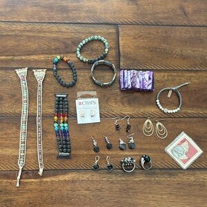 Apple Watch bands and assorted earrings, and bracelets